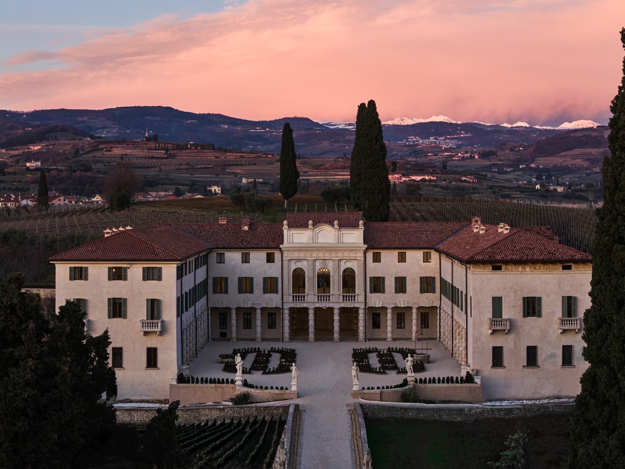 The villa and its vineyards, at dusk