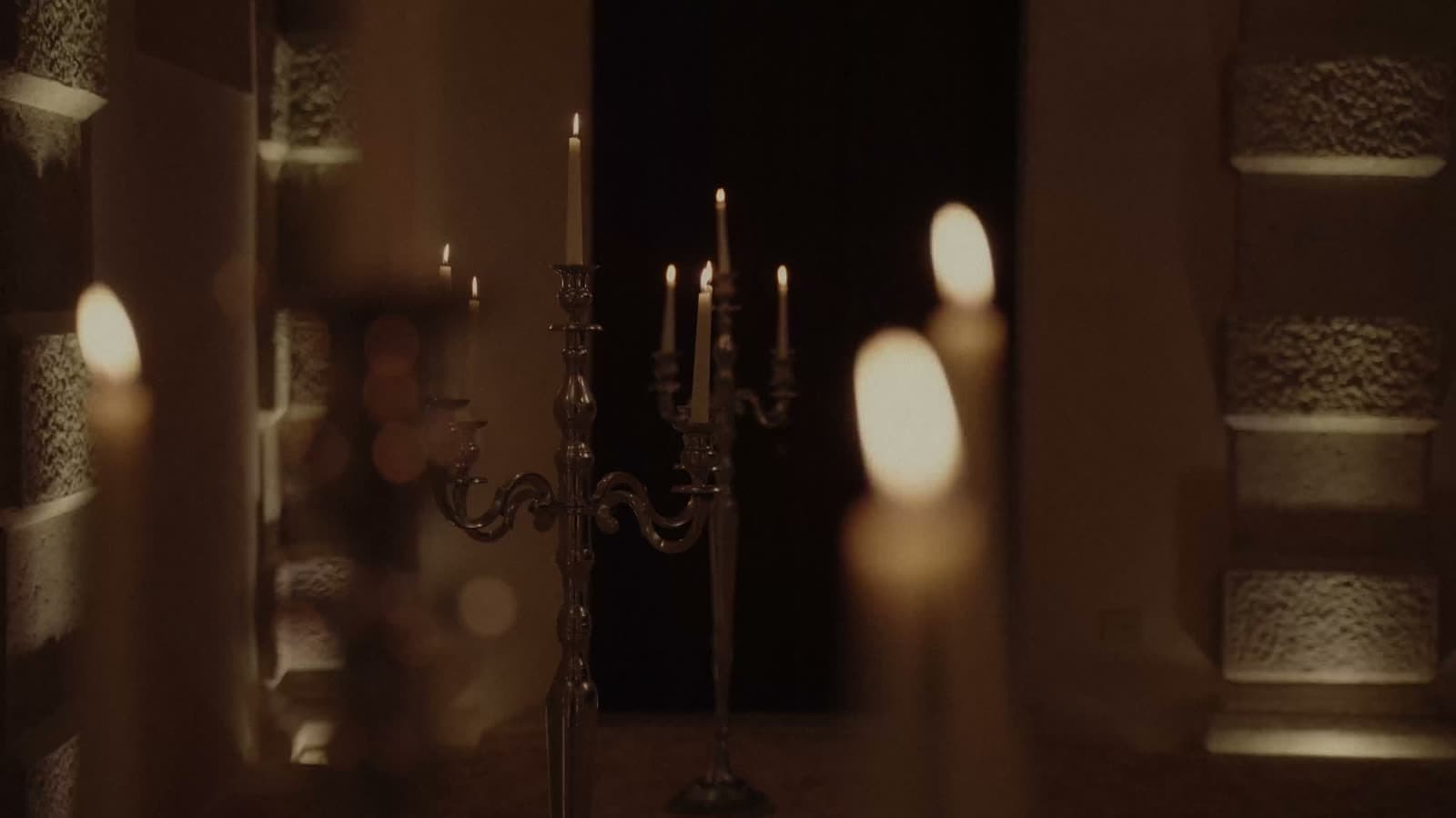 Candlelight, long tables, masks
